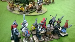 The Earl's yeomen close in on the Normans who ironically seek safety in the trees.